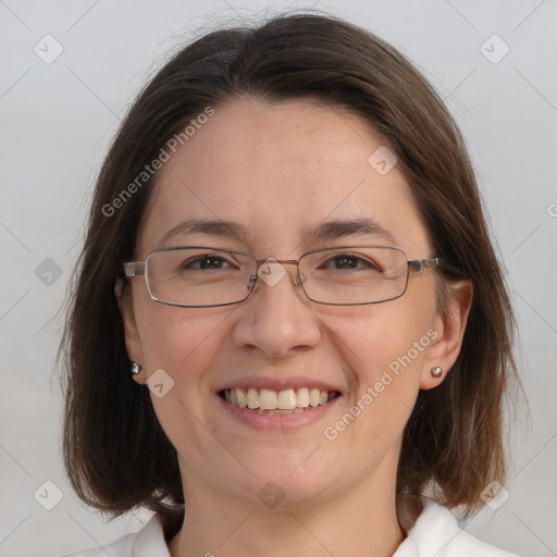 Joyful white adult female with medium  brown hair and blue eyes