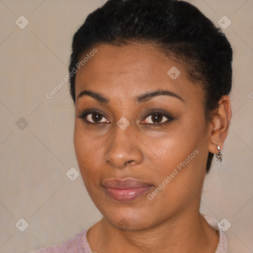 Joyful black young-adult female with short  brown hair and brown eyes