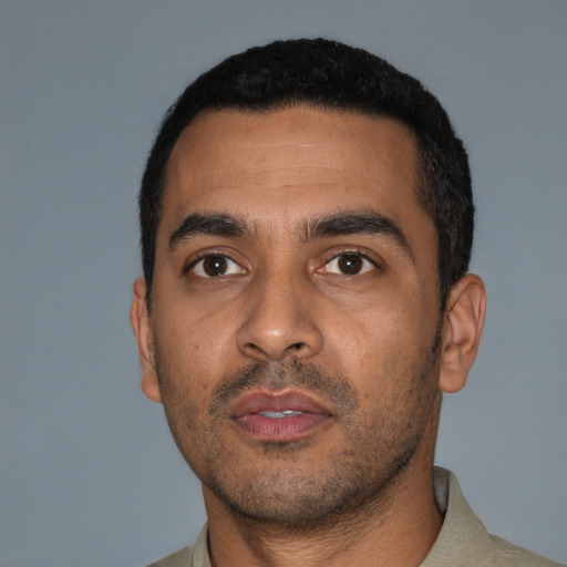 Neutral latino young-adult male with short  black hair and brown eyes