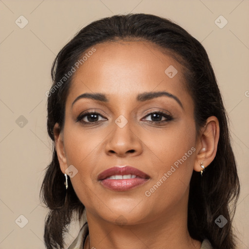 Joyful latino young-adult female with long  black hair and brown eyes