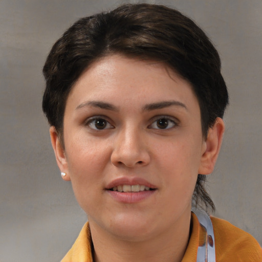 Joyful white young-adult female with medium  brown hair and brown eyes