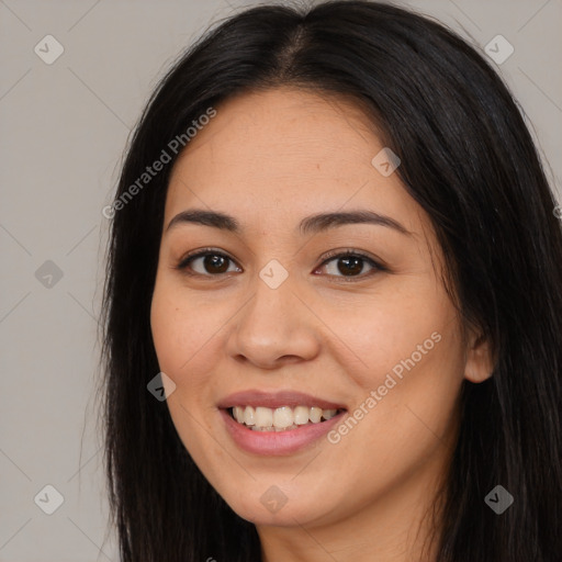 Joyful latino young-adult female with long  brown hair and brown eyes