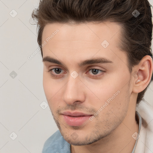 Neutral white young-adult male with short  brown hair and brown eyes