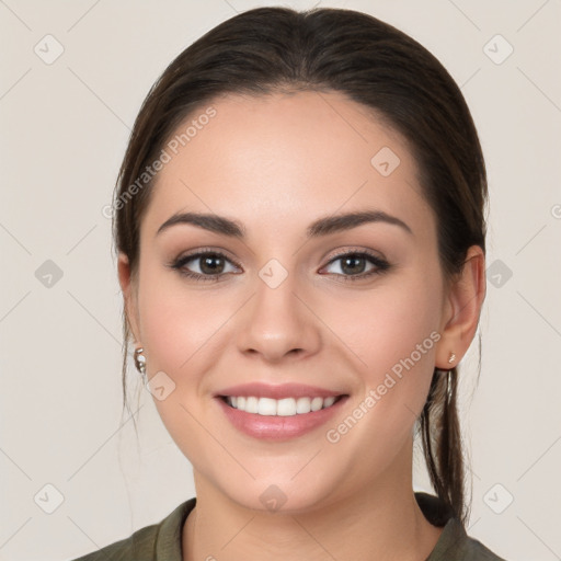 Joyful white young-adult female with long  brown hair and brown eyes