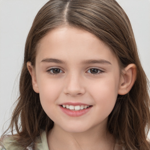 Joyful white child female with long  brown hair and brown eyes