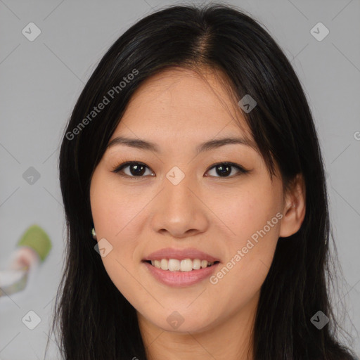 Joyful asian young-adult female with long  black hair and brown eyes