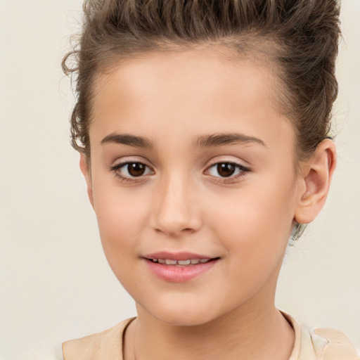 Joyful white child female with short  brown hair and brown eyes