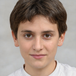 Joyful white child male with short  brown hair and brown eyes