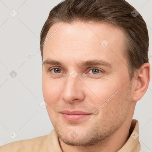 Joyful white young-adult male with short  brown hair and brown eyes