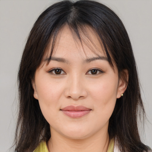 Joyful asian young-adult female with medium  brown hair and brown eyes