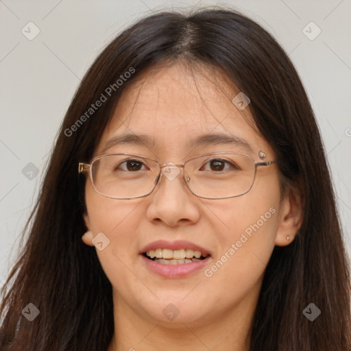 Joyful white adult female with long  brown hair and brown eyes