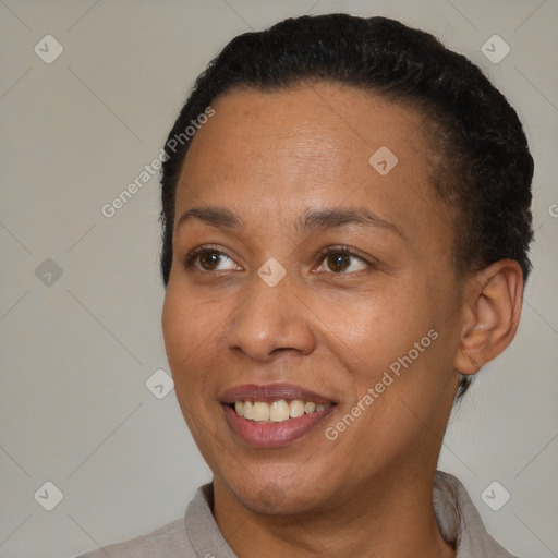 Joyful black adult female with short  brown hair and brown eyes