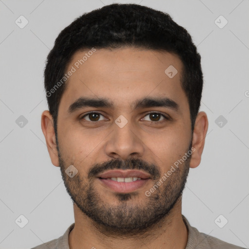 Joyful latino young-adult male with short  black hair and brown eyes