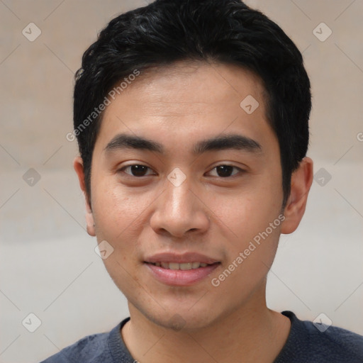 Joyful asian young-adult male with short  black hair and brown eyes