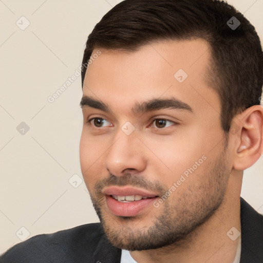 Joyful white young-adult male with short  black hair and brown eyes