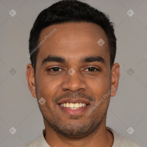 Joyful black young-adult male with short  black hair and brown eyes