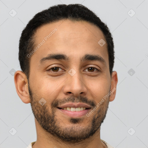 Joyful latino young-adult male with short  brown hair and brown eyes