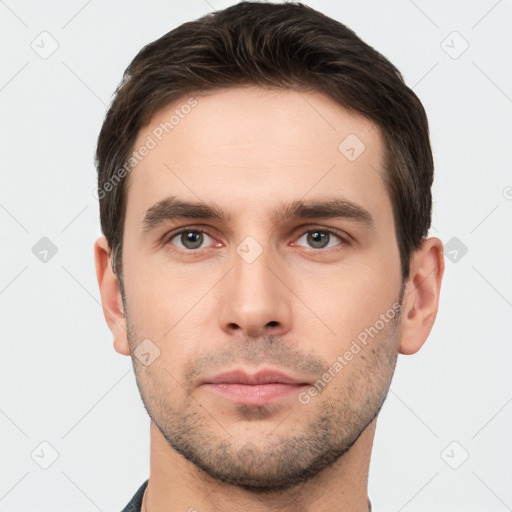 Neutral white young-adult male with short  brown hair and brown eyes