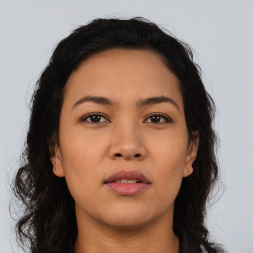 Neutral latino young-adult female with long  brown hair and brown eyes