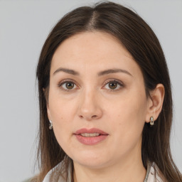 Joyful white adult female with medium  brown hair and brown eyes