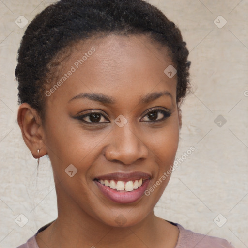 Joyful black young-adult female with short  brown hair and brown eyes