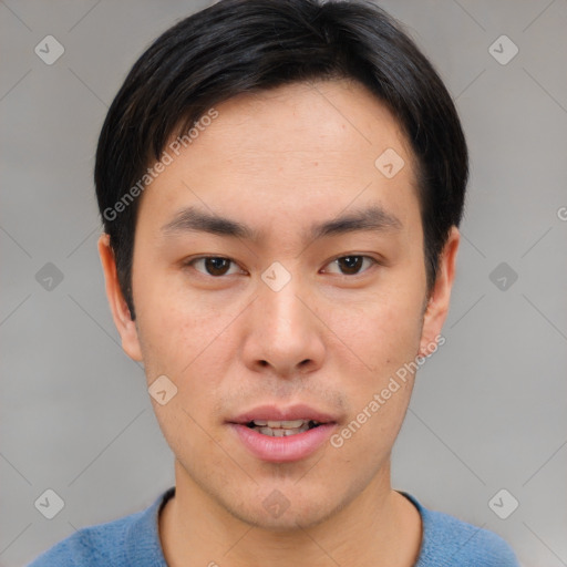 Joyful asian young-adult male with short  brown hair and brown eyes