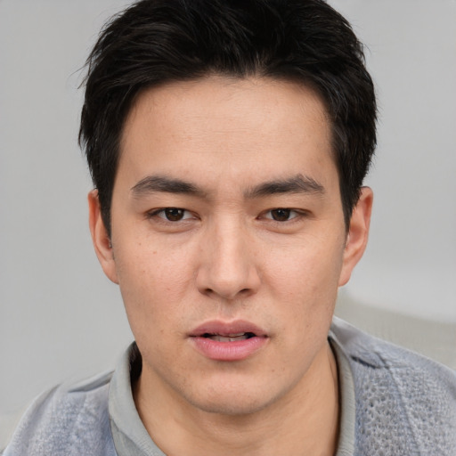 Neutral asian young-adult male with short  black hair and brown eyes