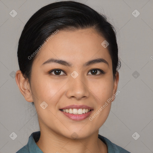 Joyful asian young-adult female with long  brown hair and brown eyes