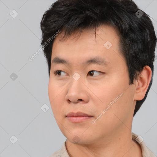 Neutral asian young-adult male with short  brown hair and brown eyes