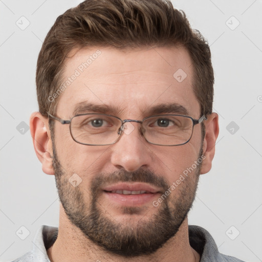 Joyful white adult male with short  brown hair and grey eyes