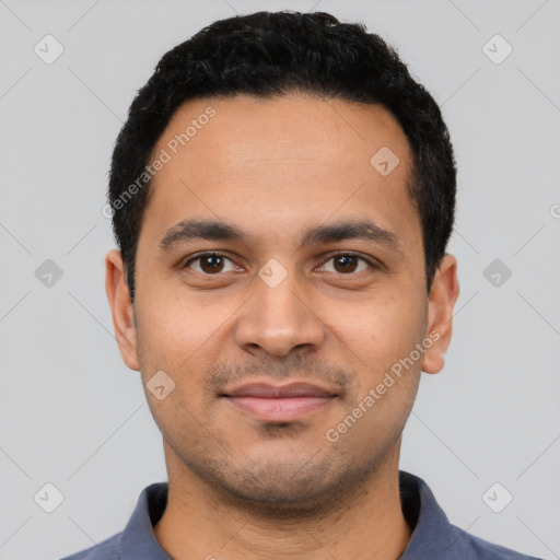 Joyful latino young-adult male with short  black hair and brown eyes