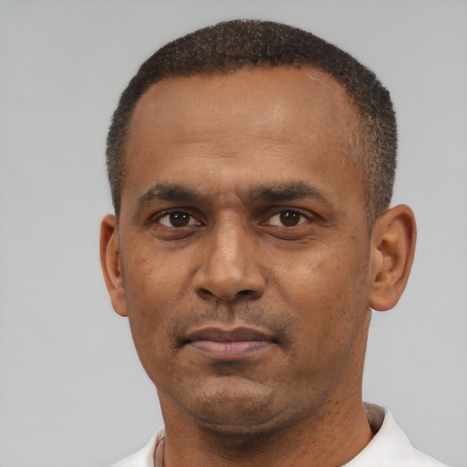 Neutral latino adult male with short  black hair and brown eyes