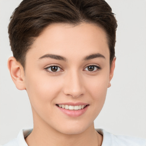 Joyful white young-adult female with short  brown hair and brown eyes