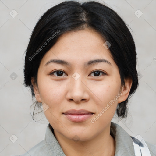 Joyful asian young-adult female with medium  black hair and brown eyes