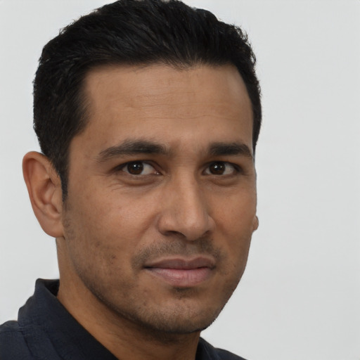 Neutral latino young-adult male with short  black hair and brown eyes