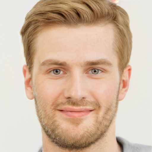 Joyful white adult male with short  brown hair and grey eyes