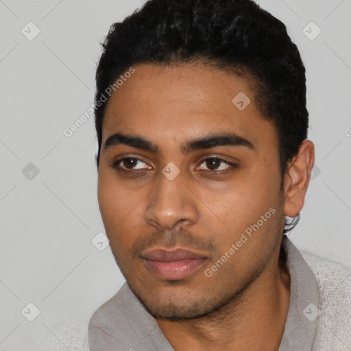 Neutral latino young-adult male with short  black hair and brown eyes