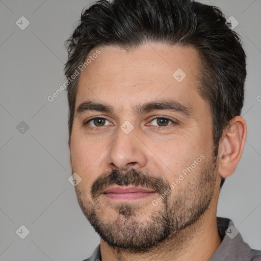 Joyful white adult male with short  brown hair and brown eyes