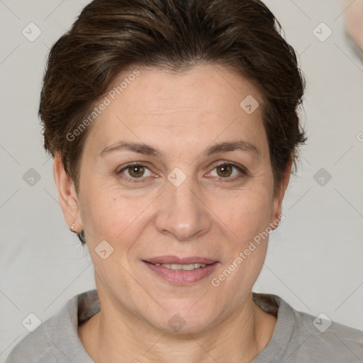 Joyful white adult female with short  brown hair and brown eyes