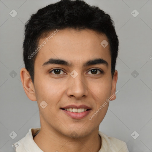 Joyful latino young-adult male with short  brown hair and brown eyes