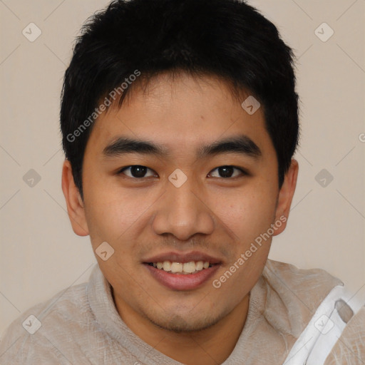 Joyful asian young-adult male with short  black hair and brown eyes