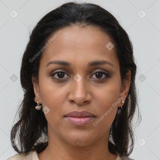 Joyful latino young-adult female with medium  brown hair and brown eyes