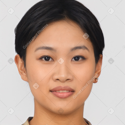 Joyful asian young-adult female with short  brown hair and brown eyes