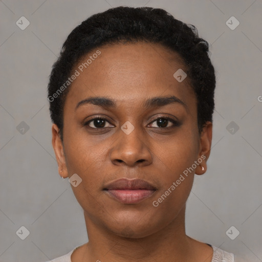 Joyful black young-adult female with short  black hair and brown eyes