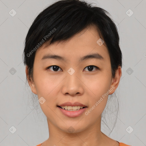 Joyful asian young-adult female with medium  black hair and brown eyes