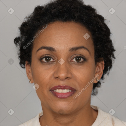 Joyful black adult female with short  brown hair and brown eyes