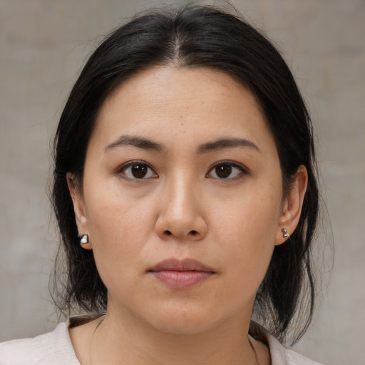 Neutral asian young-adult female with medium  brown hair and brown eyes