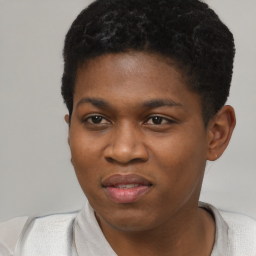 Joyful black young-adult female with short  black hair and brown eyes