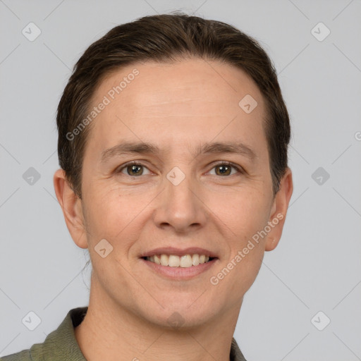 Joyful white adult male with short  brown hair and grey eyes