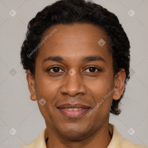 Joyful latino adult male with short  black hair and brown eyes
